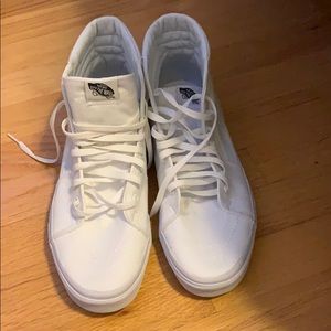 Vans white high tops. Never been worn.